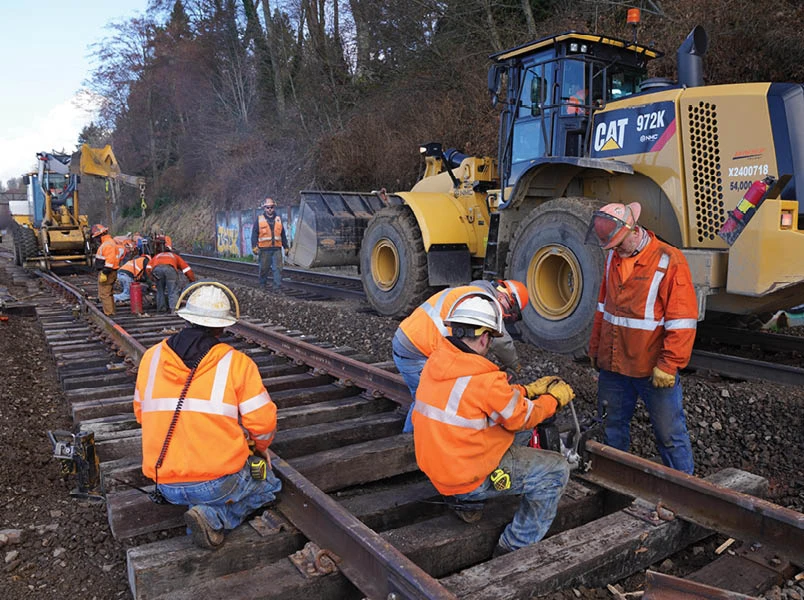 capital_investment_men_on_rail