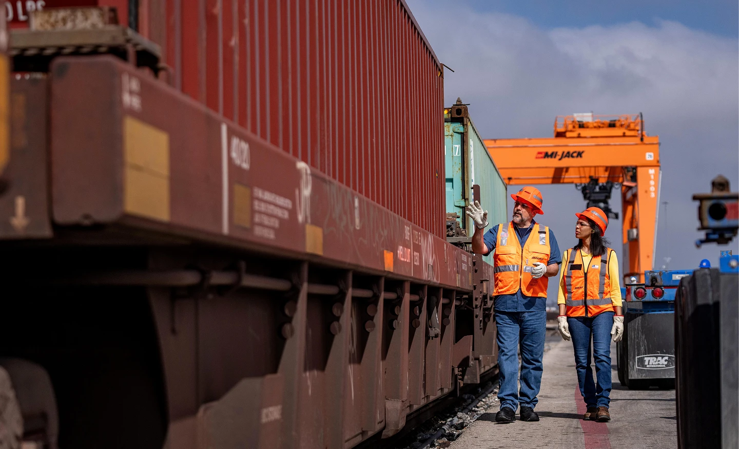 Two BNSF employees inspecting a train