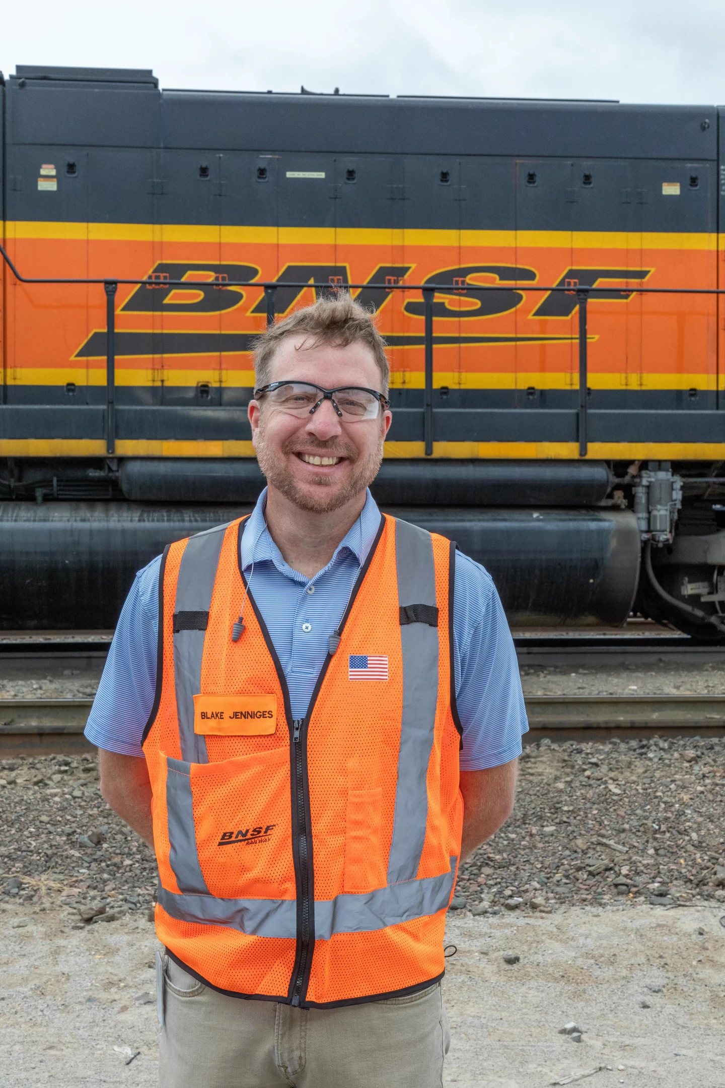 BNSF employee in front of BNSF train